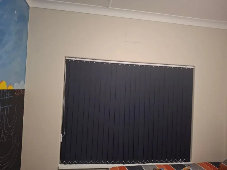 vertical 90mm blind charcoal in lounge