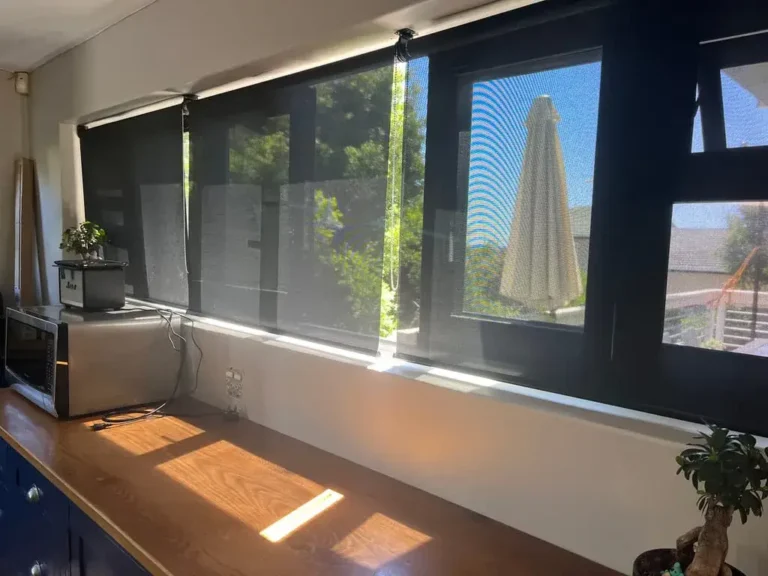 light filtering roller blind charcoal in kitchen